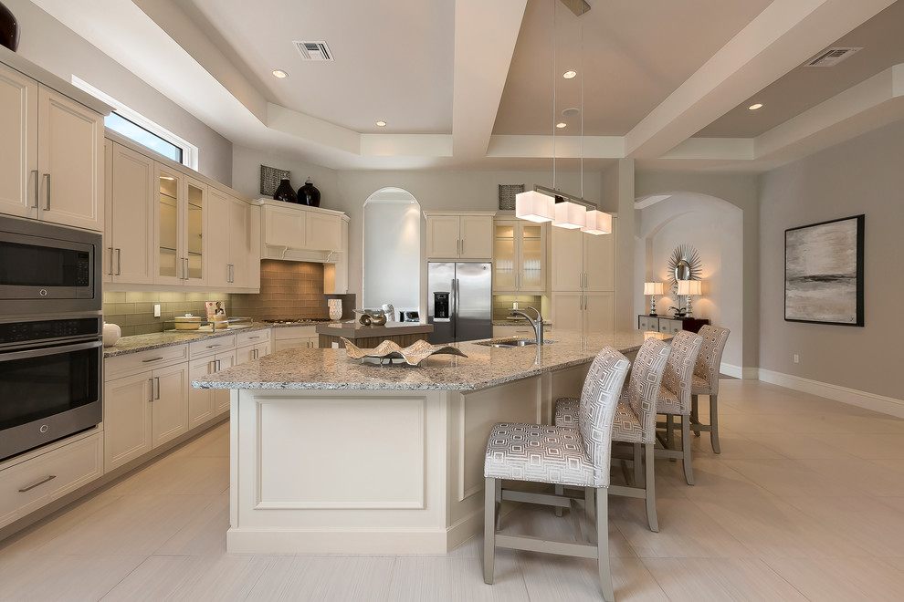Inspiration for a traditional grey and cream kitchen in Miami.