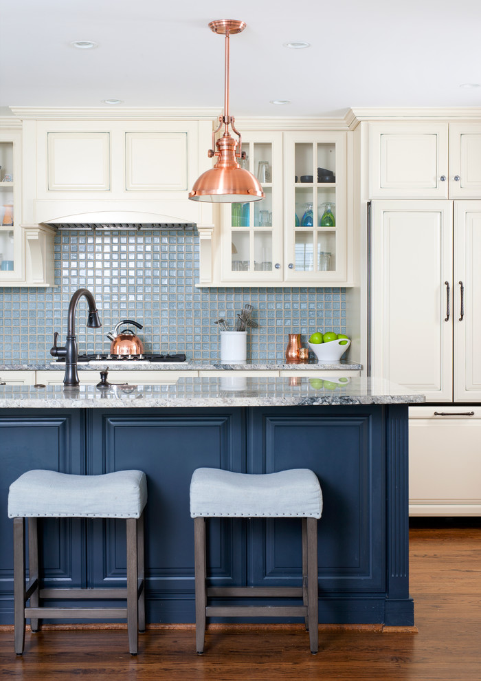 Open concept kitchen - mid-sized traditional single-wall dark wood floor open concept kitchen idea in DC Metro with a farmhouse sink, raised-panel cabinets, blue backsplash, paneled appliances, an island, white cabinets, granite countertops and ceramic backsplash