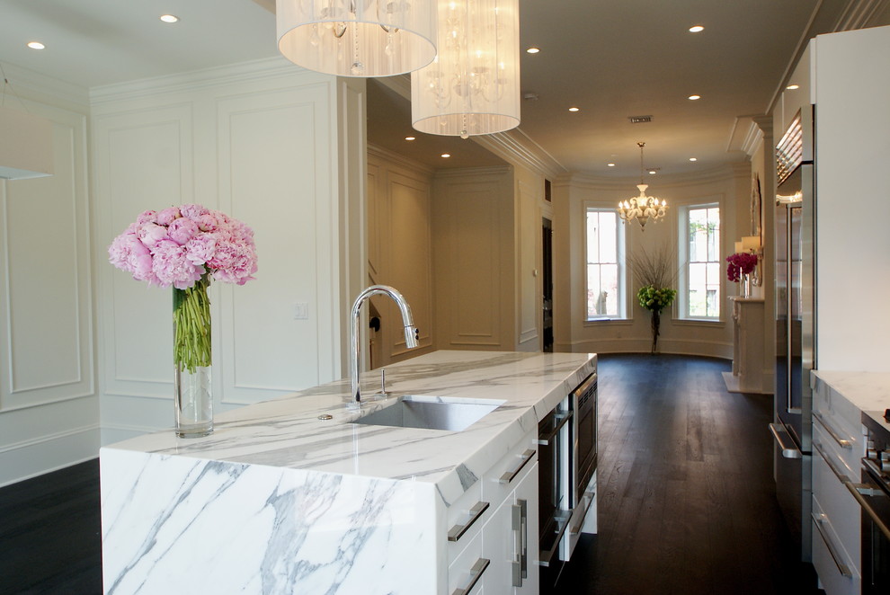 Example of a minimalist open concept kitchen design in Boston with marble countertops