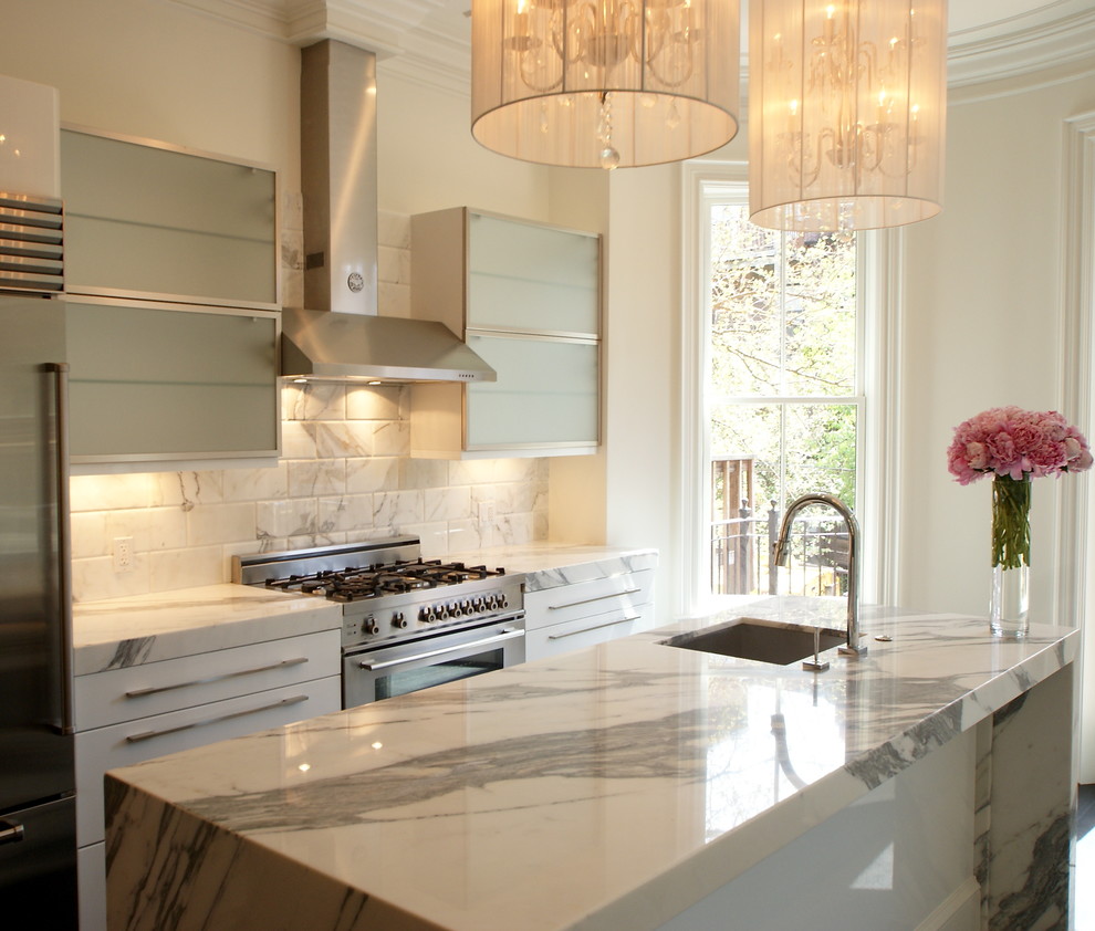 Example of a transitional kitchen design in Boston with marble countertops, a single-bowl sink, white backsplash and marble backsplash