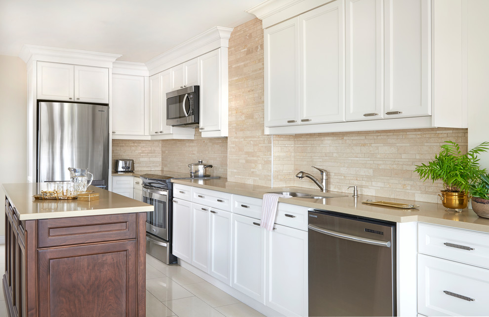 Kitchen - mid-sized traditional porcelain tile and beige floor kitchen idea in Toronto with an undermount sink, recessed-panel cabinets, white cabinets, solid surface countertops, beige backsplash, stone tile backsplash, stainless steel appliances, an island and beige countertops