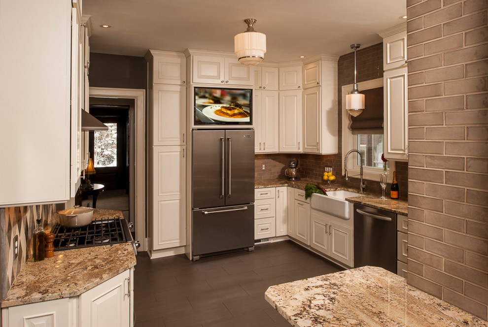 Example of a mid-sized classic l-shaped porcelain tile enclosed kitchen design in New York with a farmhouse sink, raised-panel cabinets, white cabinets, granite countertops, gray backsplash, ceramic backsplash and stainless steel appliances