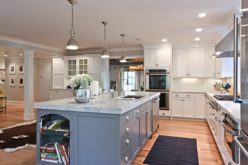 Coastal kitchen featuring natural stone countertops