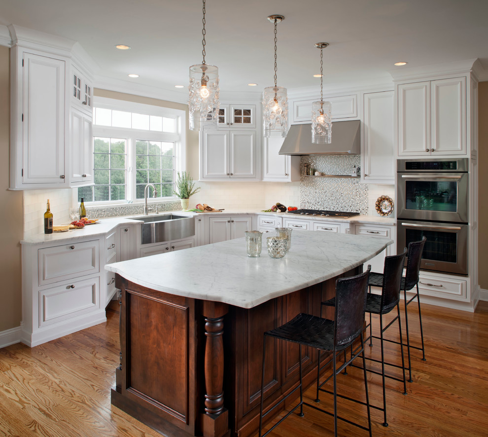 Eat-in kitchen - traditional l-shaped eat-in kitchen idea in Philadelphia with a single-bowl sink, recessed-panel cabinets, white cabinets and stainless steel appliances