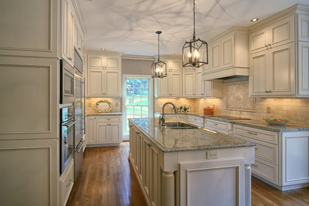 Elegant kitchen photo in Charlotte with an island