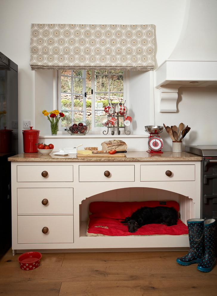 Inspiration for a kitchen remodel in Devon with beige cabinets