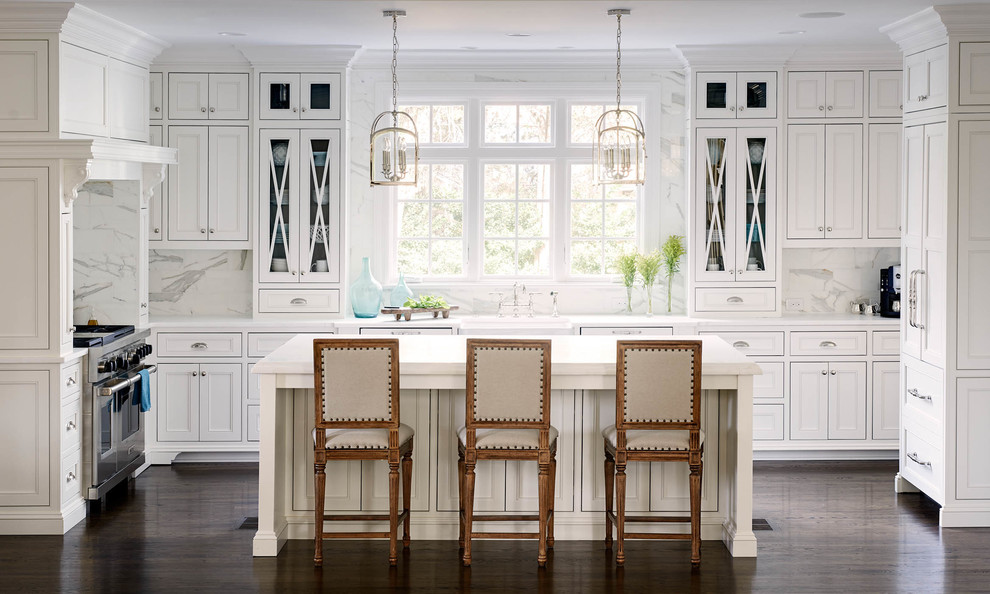Inspiration for a timeless u-shaped kitchen remodel in Charlotte with recessed-panel cabinets, white cabinets, white backsplash, stone slab backsplash and an island
