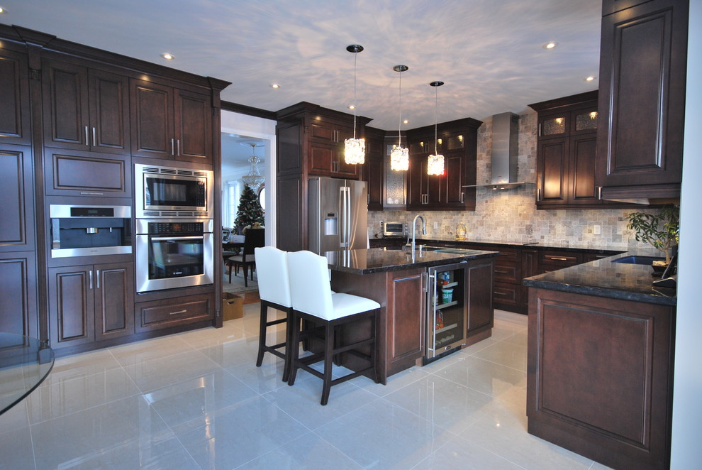 Large elegant u-shaped eat-in kitchen photo in Toronto with an undermount sink, raised-panel cabinets, brown cabinets and granite countertops