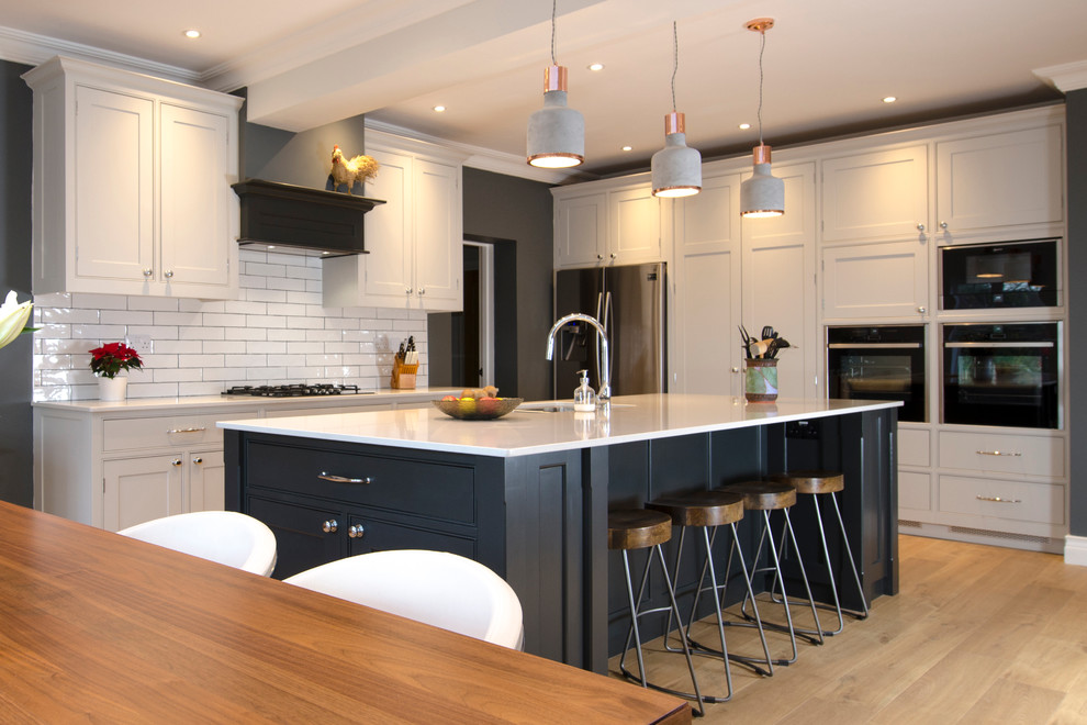 Example of a transitional kitchen design in Sussex