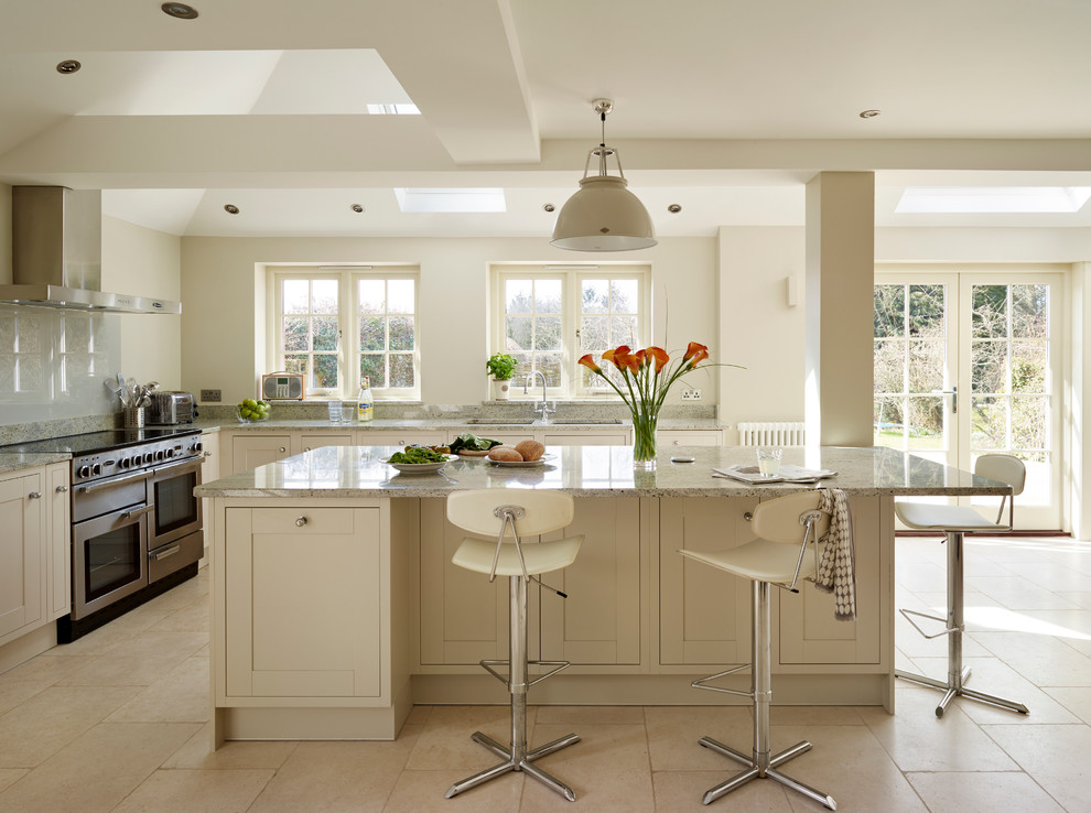 Inspiration for a large contemporary l-shaped ceramic tile eat-in kitchen remodel in Buckinghamshire with a double-bowl sink, shaker cabinets, beige cabinets, stainless steel appliances, an island, quartzite countertops, gray backsplash and glass sheet backsplash