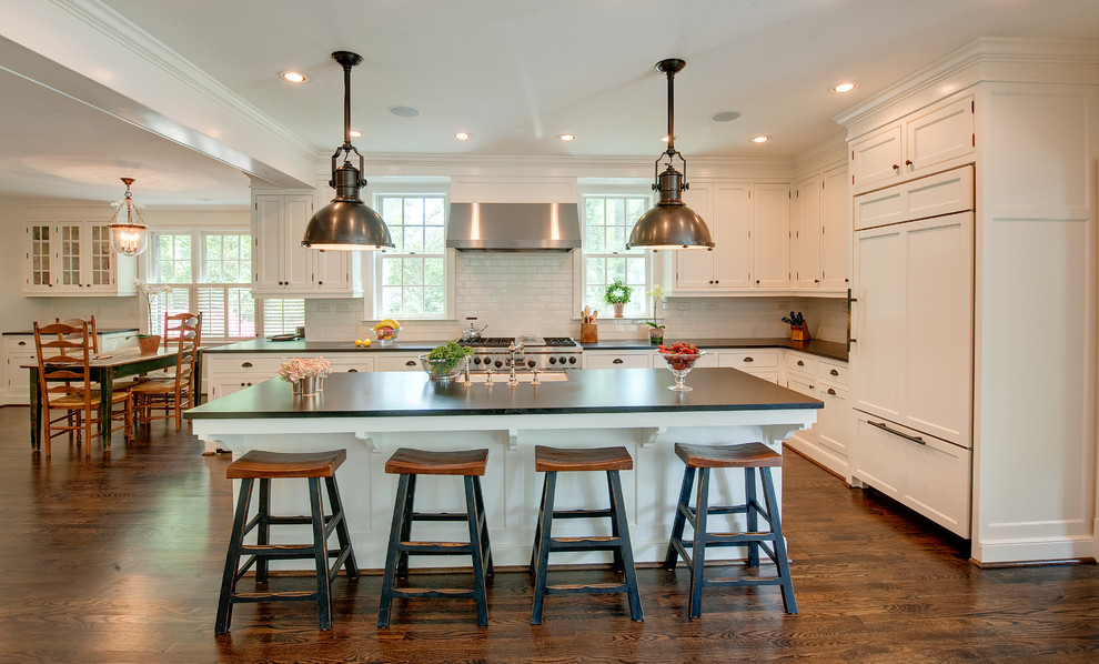 Example of a classic eat-in kitchen design in Atlanta with beaded inset cabinets, white cabinets and an island
