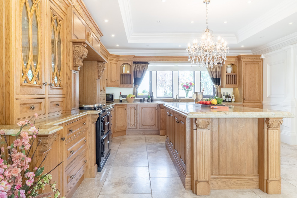 This is an example of a large victorian kitchen in Essex with an island.