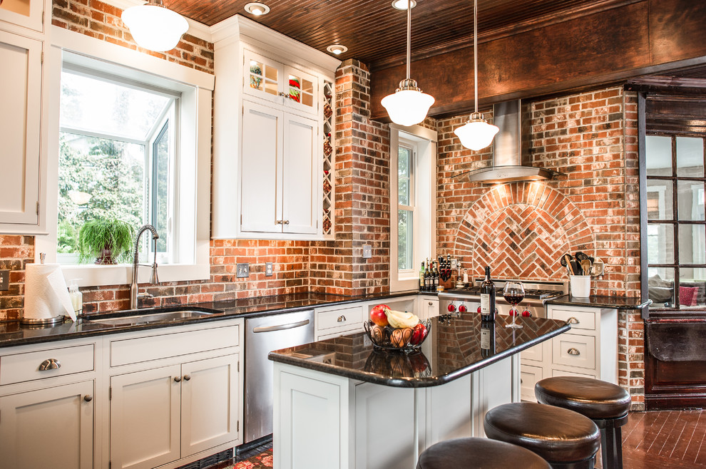 Inspiration for a transitional kitchen remodel in Philadelphia with beaded inset cabinets, white cabinets, granite countertops, red backsplash, subway tile backsplash, stainless steel appliances and an island