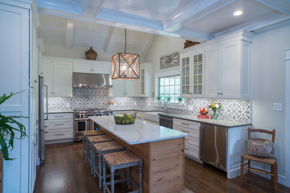 Inspiration for a large cottage u-shaped dark wood floor and brown floor eat-in kitchen remodel in Other with a farmhouse sink, shaker cabinets, white cabinets, quartzite countertops, multicolored backsplash, cement tile backsplash, stainless steel appliances and an island