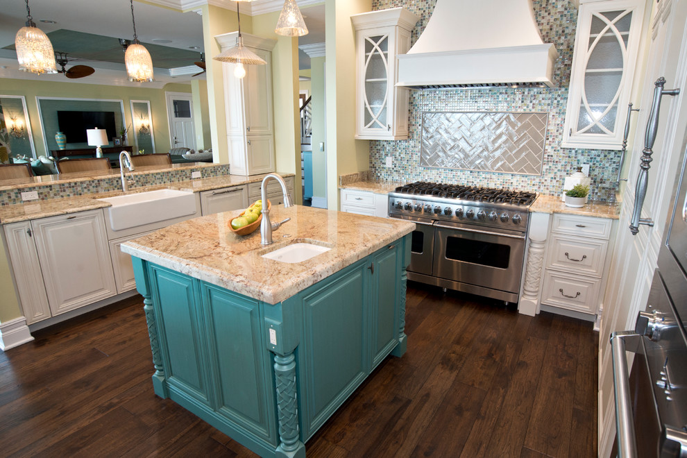 Example of a mid-sized transitional u-shaped dark wood floor open concept kitchen design in Tampa with a farmhouse sink, raised-panel cabinets, white cabinets, granite countertops, multicolored backsplash, mosaic tile backsplash, stainless steel appliances and two islands