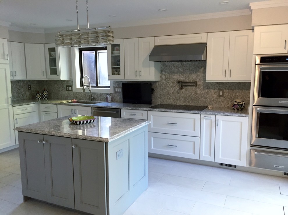 Inspiration for a large contemporary l-shaped porcelain tile eat-in kitchen remodel in Baltimore with a drop-in sink, shaker cabinets, white cabinets, quartz countertops, gray backsplash, stone slab backsplash, stainless steel appliances and an island