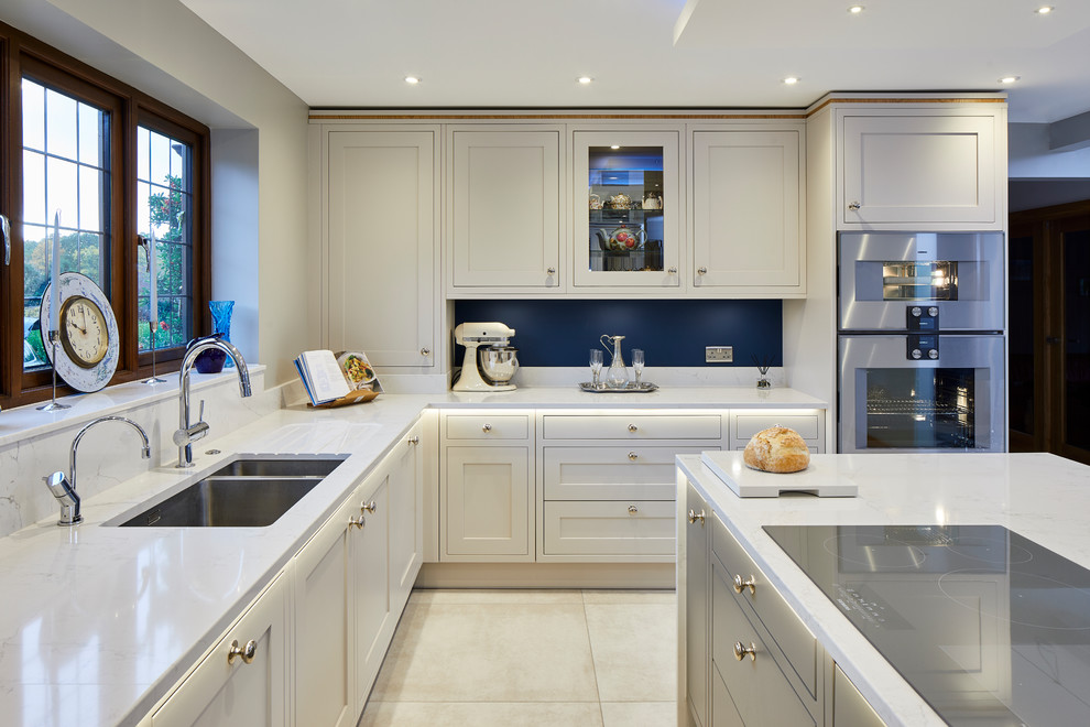 Classic white kitchen with circular oak breakfast bar Modern