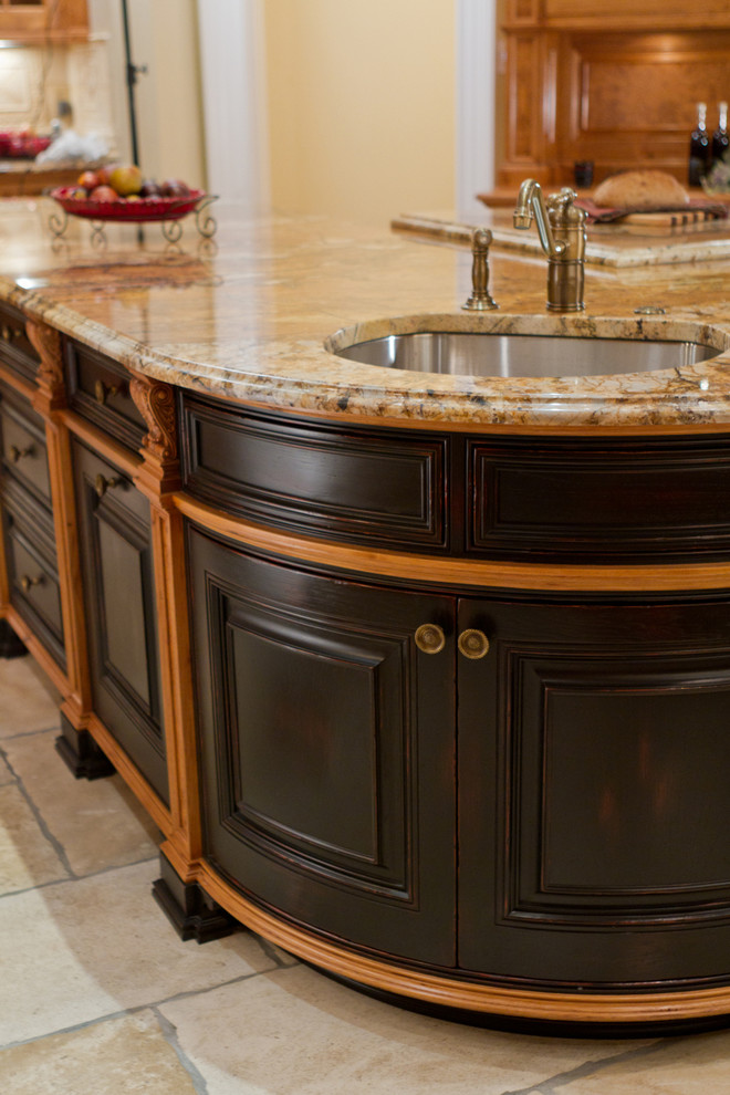 Inspiration for a timeless kitchen remodel in Atlanta with an undermount sink, dark wood cabinets and beaded inset cabinets