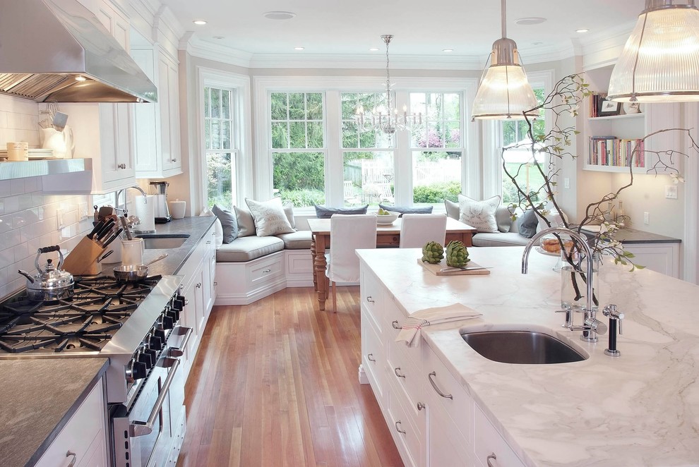 Example of a classic kitchen design in New York with white countertops