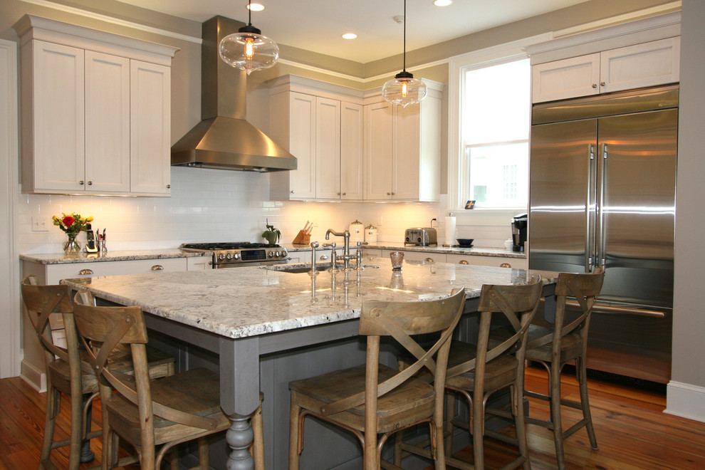 Classically Inspired Kitchen with Stainless Chimney Hood and Pantry