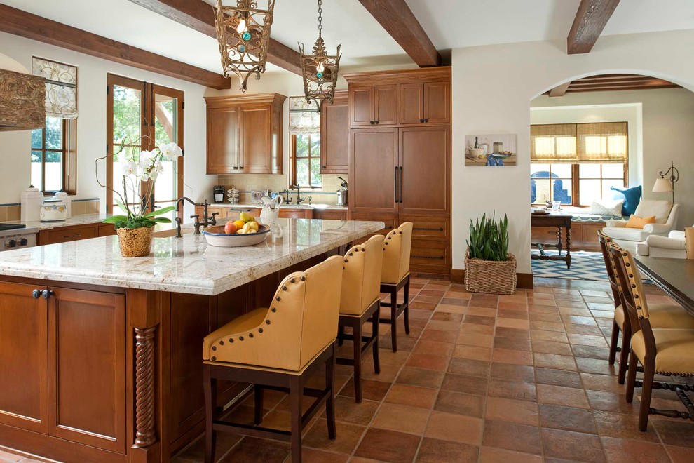 Inspiration for a mediterranean terra-cotta tile kitchen remodel in San Diego with a farmhouse sink and stainless steel appliances