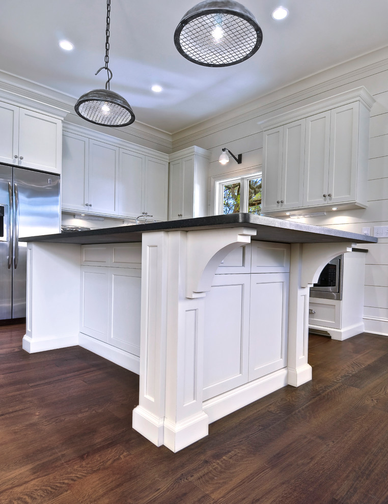 Design ideas for a medium sized nautical u-shaped kitchen/diner in Charleston with shaker cabinets, white cabinets, stainless steel appliances, a belfast sink and granite worktops.