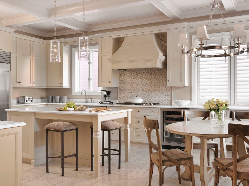 Inspiration for a traditional kitchen/diner in St Louis with recessed-panel cabinets, white cabinets, multi-coloured splashback, stainless steel appliances and an island.
