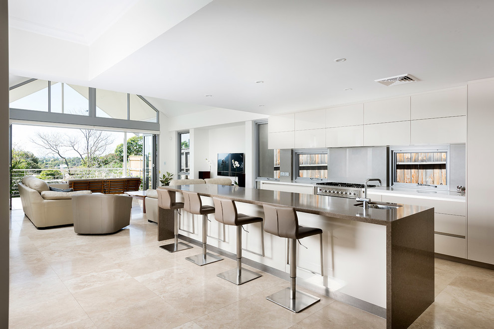 This is an example of a contemporary open plan kitchen in Perth with a submerged sink, flat-panel cabinets, white cabinets, grey splashback, stainless steel appliances and an island.