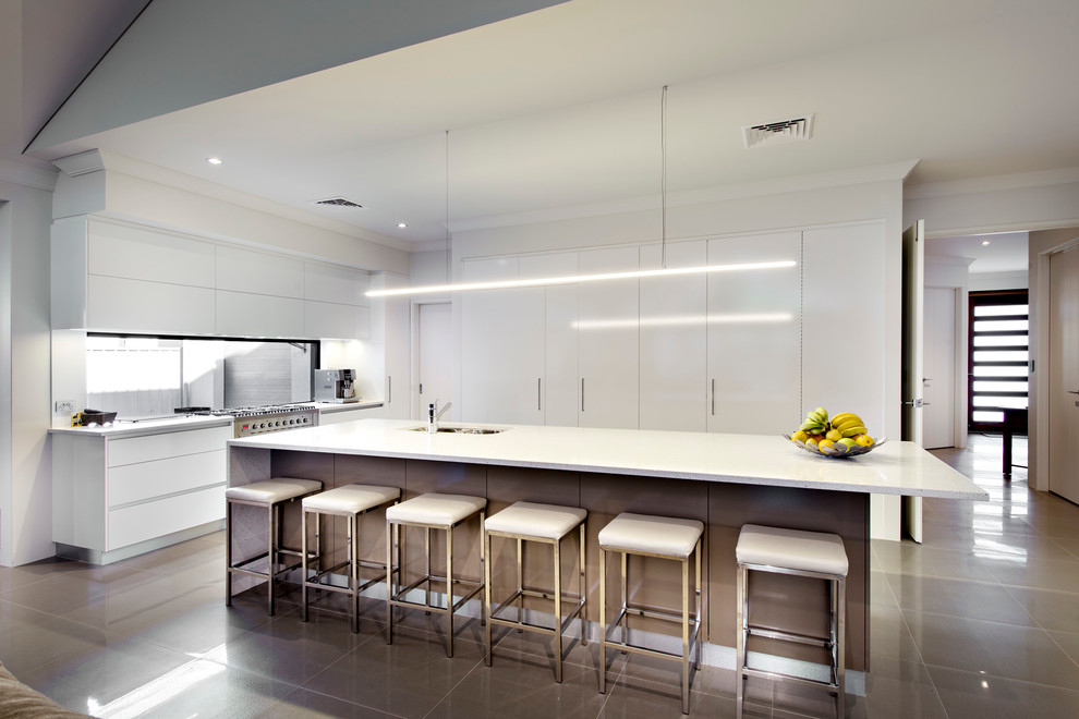 Design ideas for a contemporary l-shaped kitchen in Perth with a submerged sink, flat-panel cabinets, white cabinets, stainless steel appliances and an island.