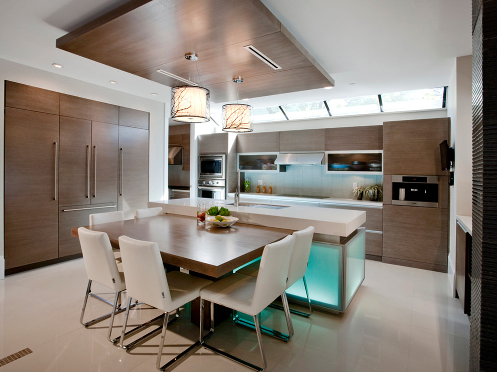 Trendy eat-in kitchen photo in Vancouver with beige backsplash, paneled appliances, medium tone wood cabinets and marble countertops