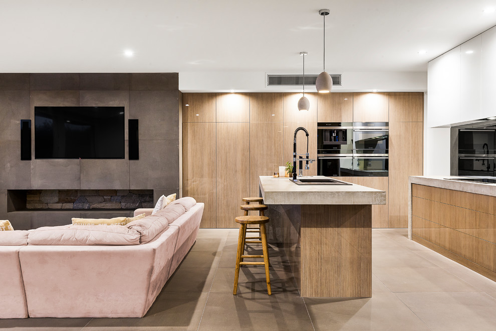 Design ideas for a contemporary kitchen in Melbourne with a double-bowl sink, recessed-panel cabinets, light wood cabinets, concrete worktops, black splashback, glass sheet splashback, limestone flooring, an island and grey floors.