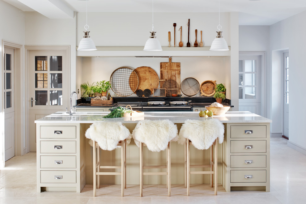 Inspiration for a scandinavian galley kitchen remodel in Wiltshire with flat-panel cabinets, beige cabinets and an island