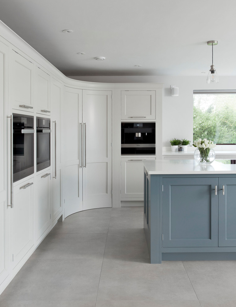 Photo of a large contemporary l-shaped open plan kitchen in Belfast with shaker cabinets, grey cabinets, quartz worktops, an island and white worktops.