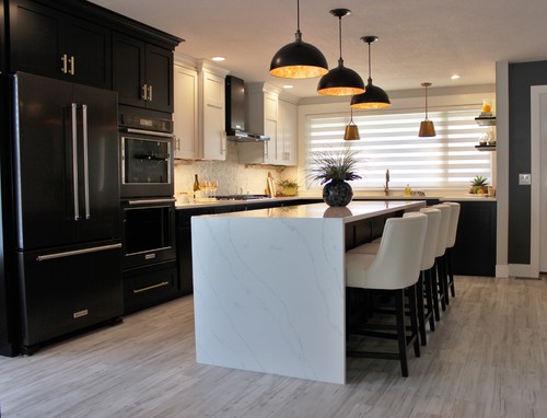 White countertops and black cabinets with gold