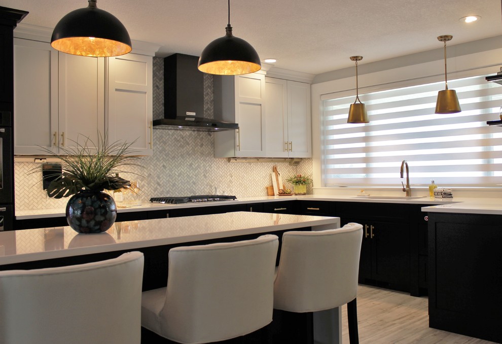 Large transitional l-shaped vinyl floor and gray floor open concept kitchen photo in Other with an undermount sink, flat-panel cabinets, black cabinets, quartz countertops, white backsplash, marble backsplash, black appliances and an island