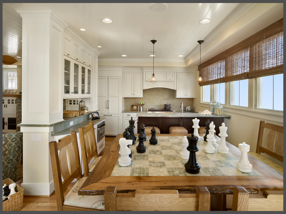 Eat-in kitchen - mid-sized traditional single-wall light wood floor eat-in kitchen idea in New York with a drop-in sink, flat-panel cabinets, white cabinets, quartz countertops, beige backsplash, mosaic tile backsplash, paneled appliances and two islands