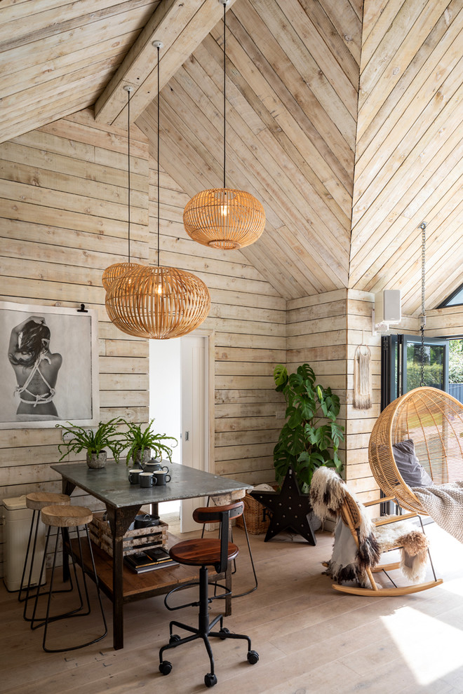 Design ideas for a medium sized coastal open plan kitchen in Sussex with light hardwood flooring, an island and beige floors.