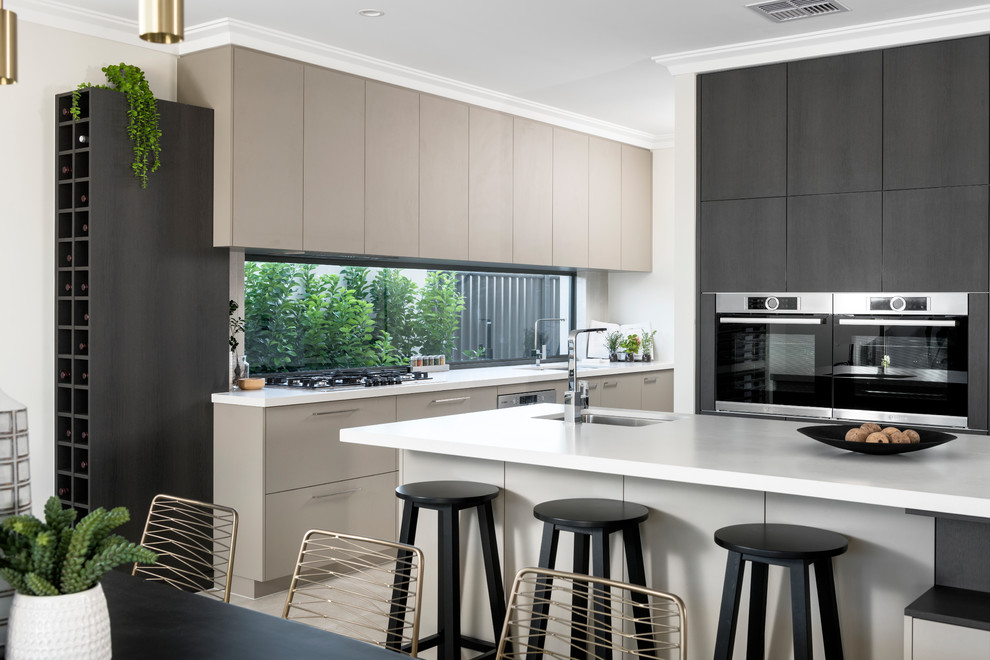 Trendy l-shaped eat-in kitchen photo in Perth with an undermount sink, flat-panel cabinets, black cabinets, window backsplash, black appliances and an island