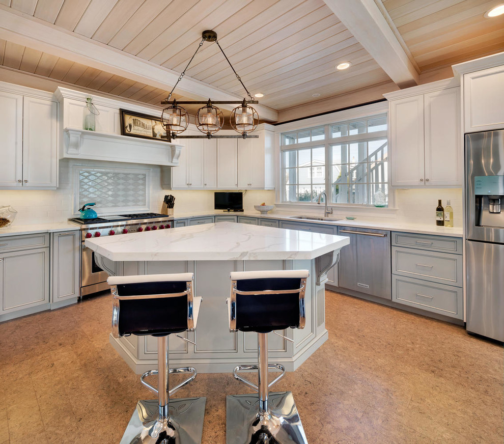 Inspiration for a coastal cork floor eat-in kitchen remodel in New York with an undermount sink, recessed-panel cabinets, gray cabinets, quartz countertops, white backsplash, subway tile backsplash, stainless steel appliances and an island