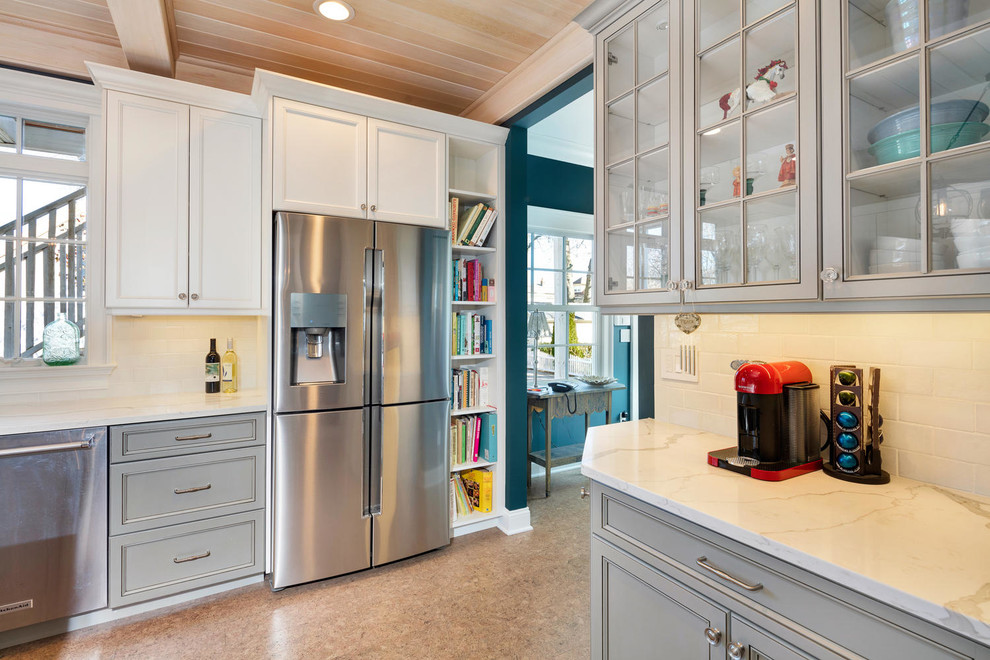 Eat-in kitchen - coastal cork floor eat-in kitchen idea in New York with an undermount sink, recessed-panel cabinets, gray cabinets, quartz countertops, white backsplash, subway tile backsplash, stainless steel appliances and an island