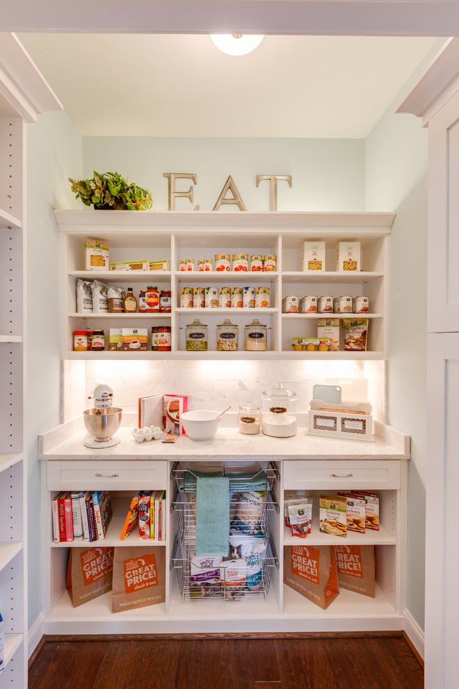 Example of a small classic single-wall dark wood floor kitchen pantry design in Other with open cabinets and white cabinets