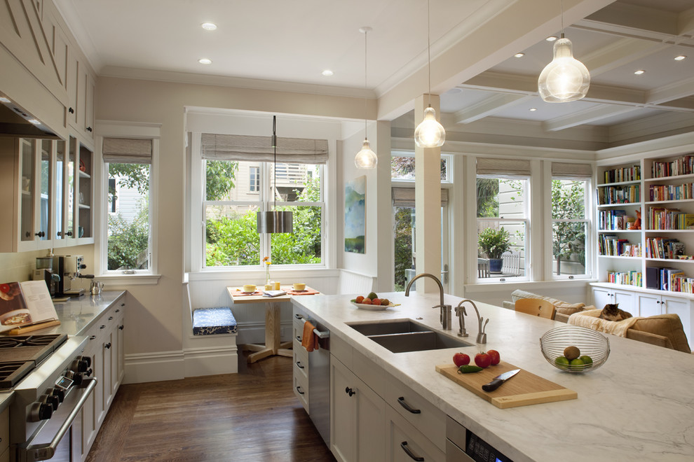 Design ideas for a traditional kitchen in San Francisco with glass-front cabinets and stainless steel appliances.