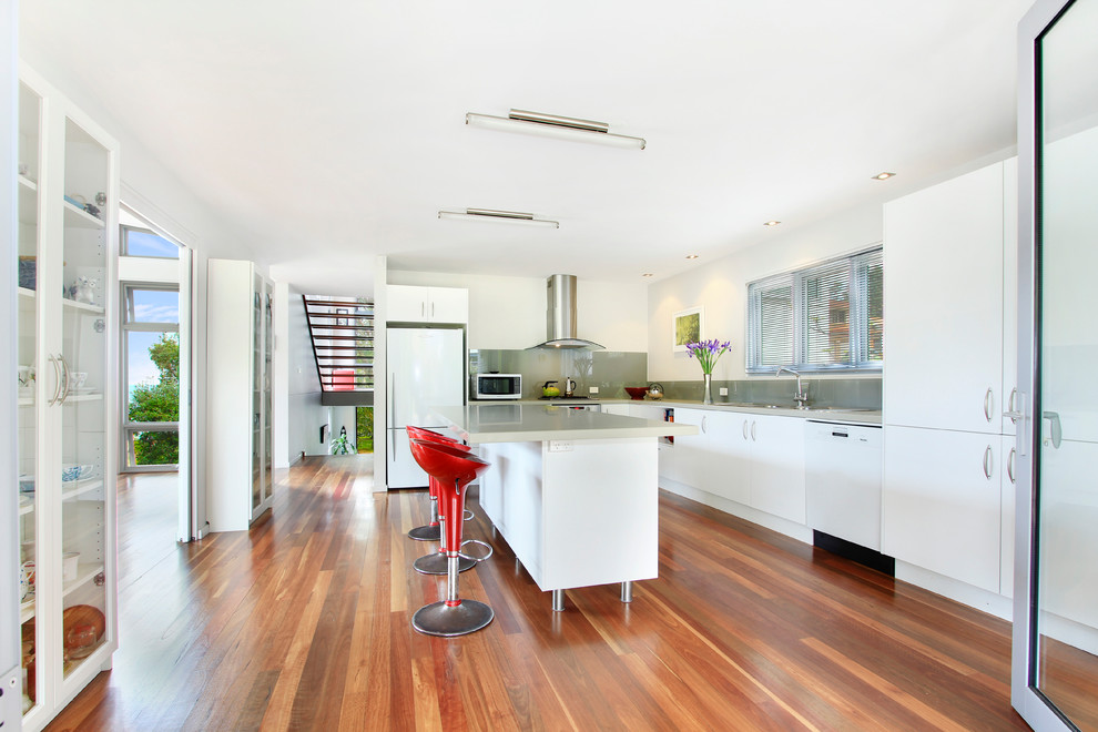 Inspiration for a modern kitchen in Sydney with flat-panel cabinets and stainless steel appliances.