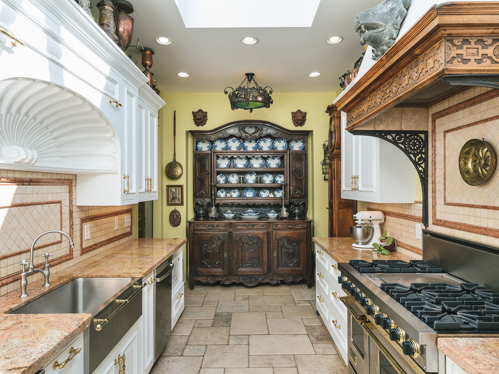 Inspiration for a victorian galley enclosed kitchen in Portland with a belfast sink, recessed-panel cabinets, white cabinets, beige splashback, stainless steel appliances, no island, beige floors and brown worktops.