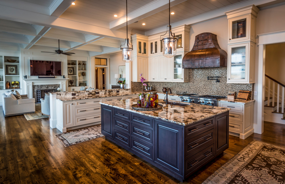 Inspiration for a large traditional u-shaped kitchen/diner in Charleston with a submerged sink, glass-front cabinets, white cabinets, granite worktops, brown splashback, mosaic tiled splashback, stainless steel appliances, an island, brown floors and medium hardwood flooring.