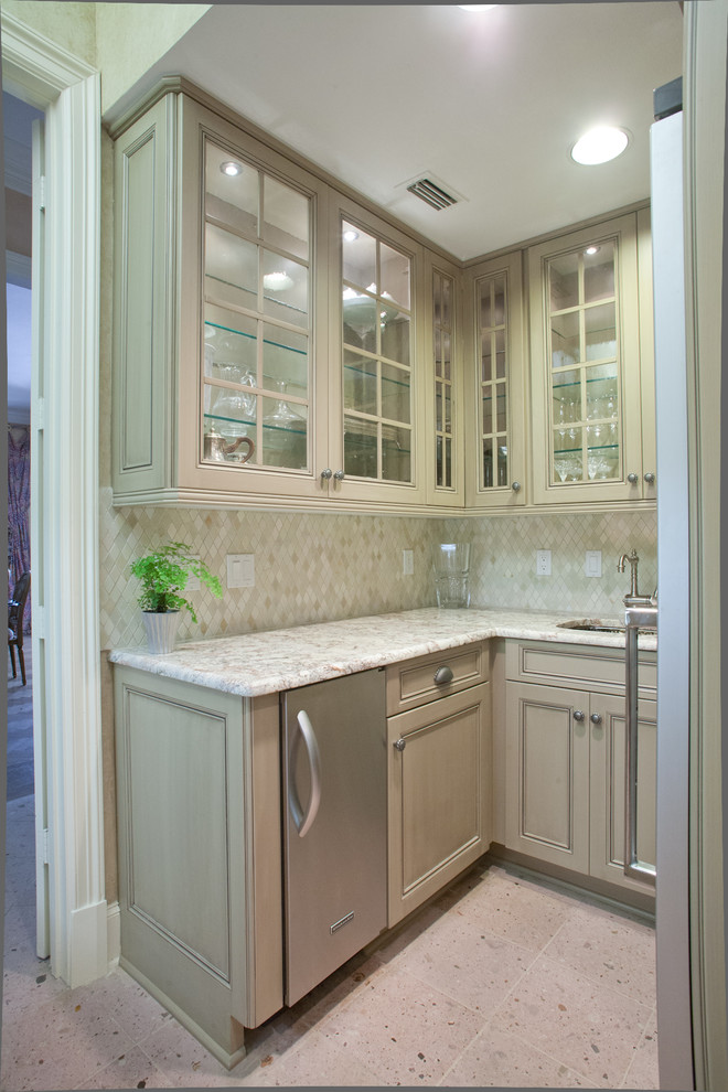 Inspiration for a timeless u-shaped eat-in kitchen remodel in Dallas with a farmhouse sink, recessed-panel cabinets, beige cabinets, granite countertops, multicolored backsplash, ceramic backsplash and stainless steel appliances