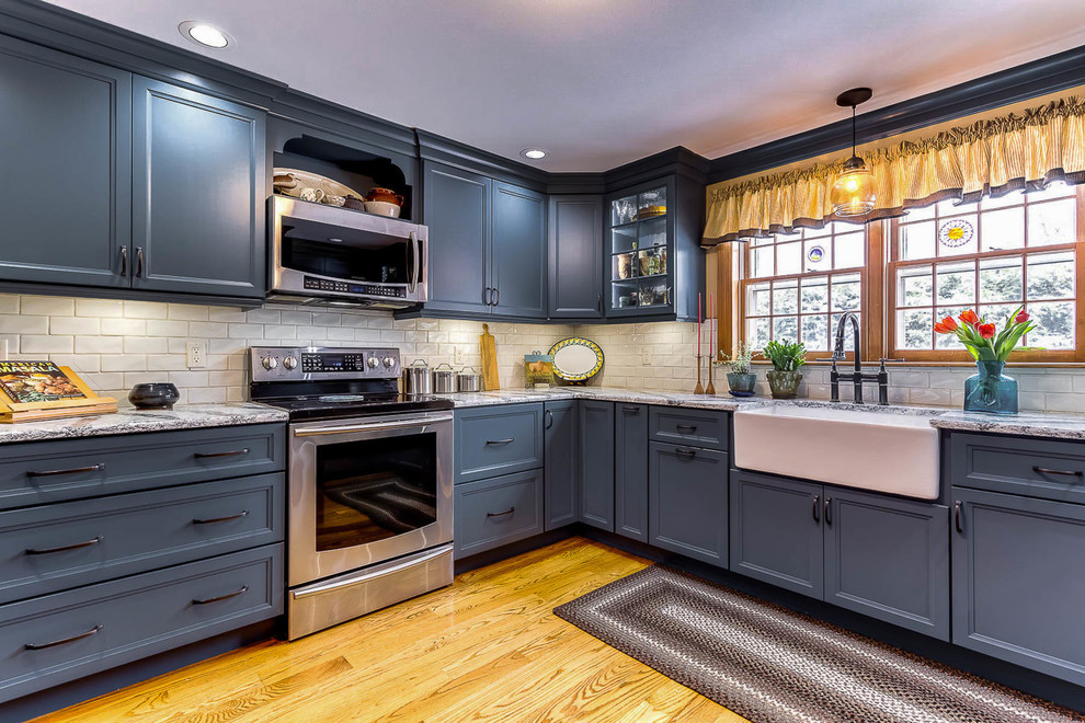 blue colonial kitchen cabinet and khaki wall