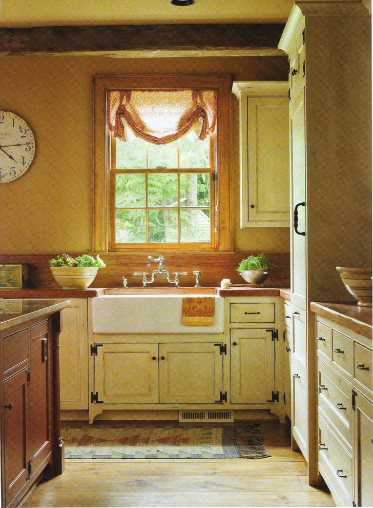 Kitchen - farmhouse kitchen idea in Seattle with yellow cabinets