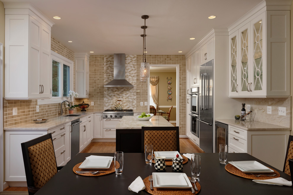 Eat-in kitchen - large transitional l-shaped light wood floor eat-in kitchen idea in DC Metro with an undermount sink, recessed-panel cabinets, white cabinets, granite countertops, gray backsplash, mosaic tile backsplash, stainless steel appliances and an island