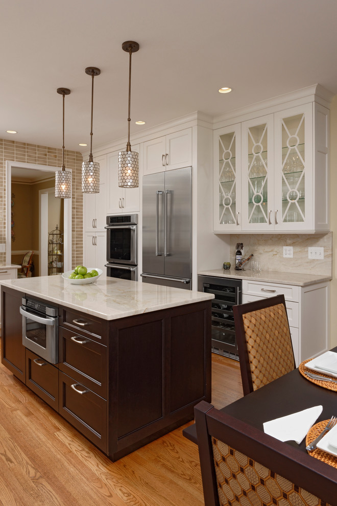 Example of a large transitional l-shaped light wood floor eat-in kitchen design in DC Metro with an undermount sink, recessed-panel cabinets, white cabinets, granite countertops, gray backsplash, mosaic tile backsplash, stainless steel appliances and an island